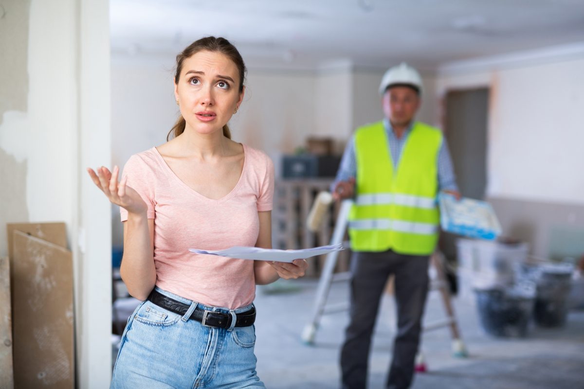 Portrait,of,confused,woman,apartment,owner,holding,document.,repair,works