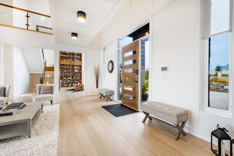 Open-plan living area with fireplace and exposed timber beams