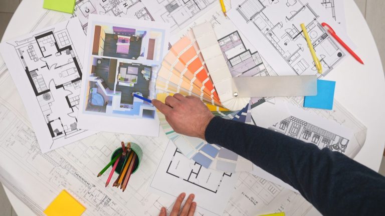 Building plans and design materials laid out for review