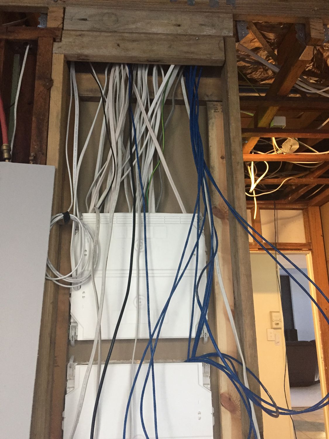 New switchboard with CAT6 data cables and electrical wiring during first-fix stage of Southport home renovation